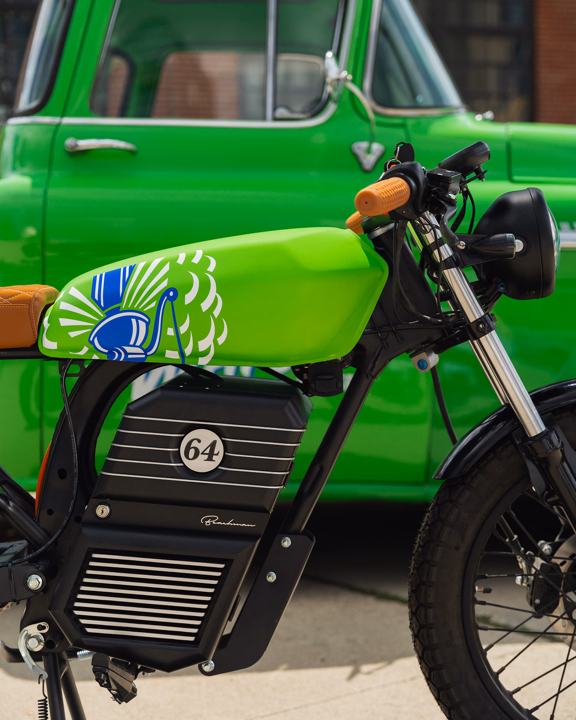 The hand-painted tank and '64 badge up close