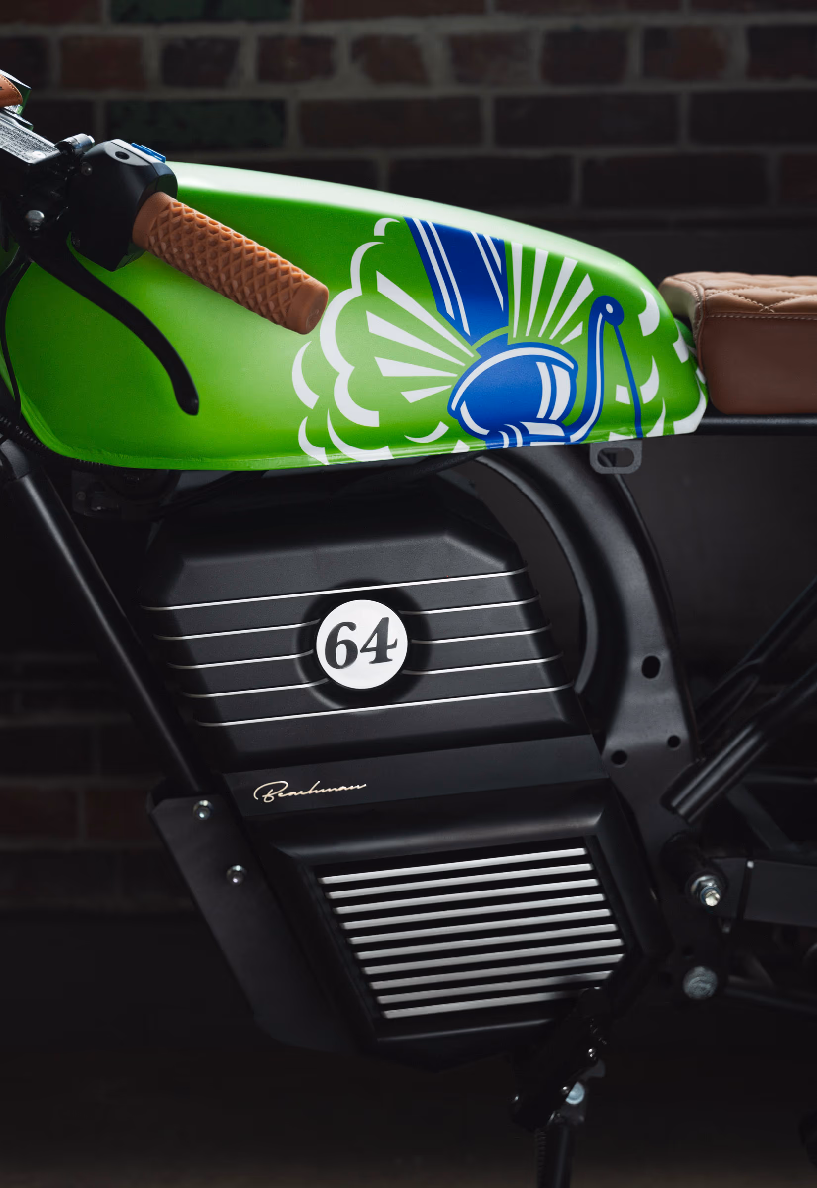 Close-up of the Steam Whistle-painted Beachman tank against a brick wall