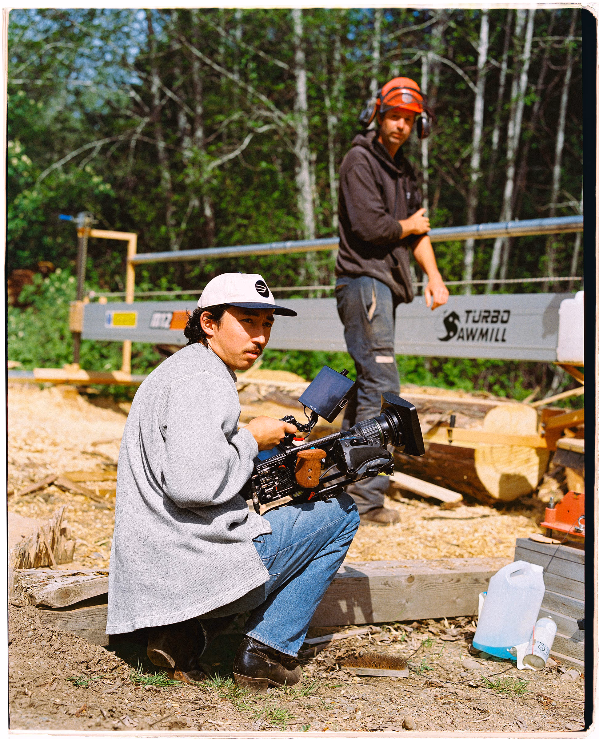 Eric at the portable sawmill, saw in hand