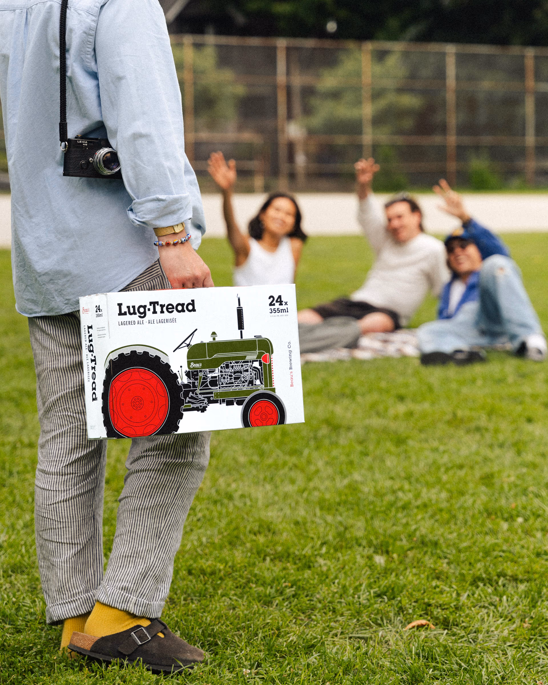 Carrying the Lug Tread 24 through the park, camera slung