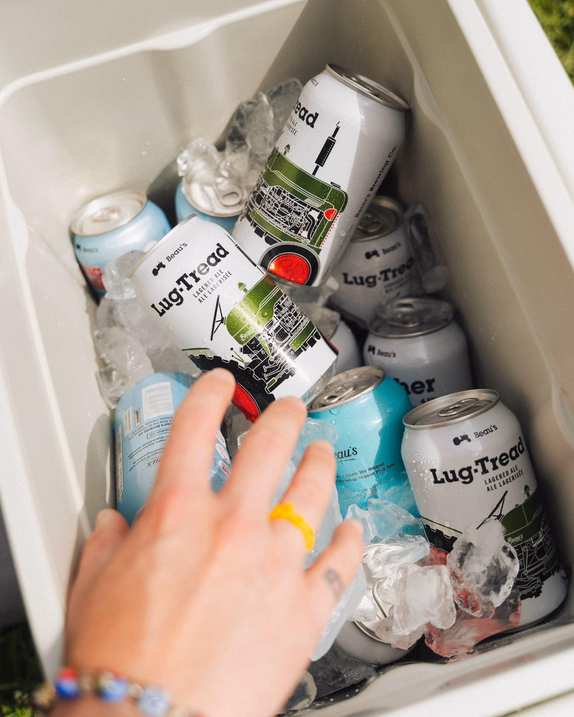 The cooler packed with Lug Tread cans and ice