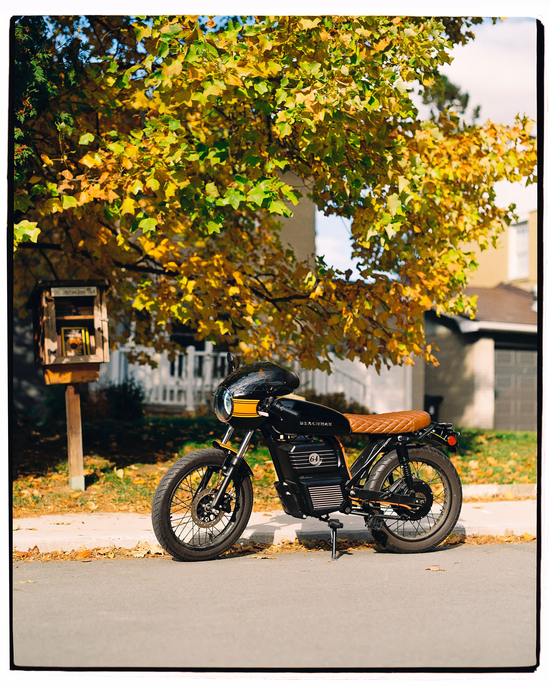 A Beachman parked kerbside beneath an autumn tree, shot on film