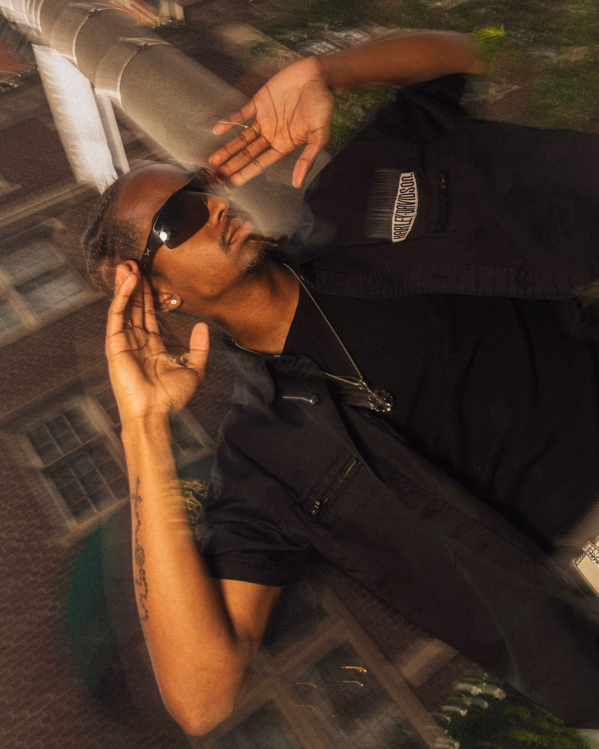 A double exposure — his face in the glass reflection