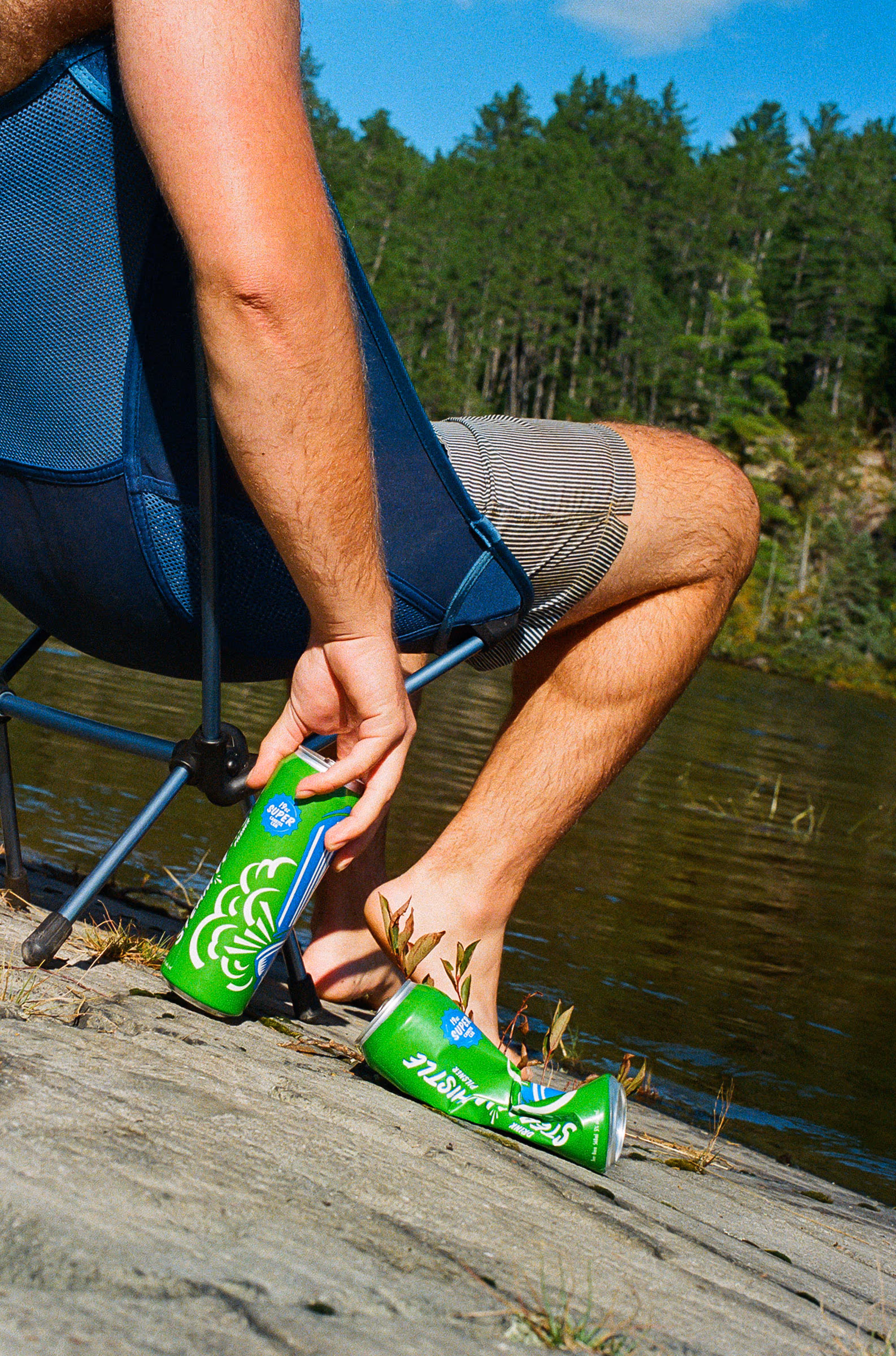 Reaching for a cold one beside the camp chair
