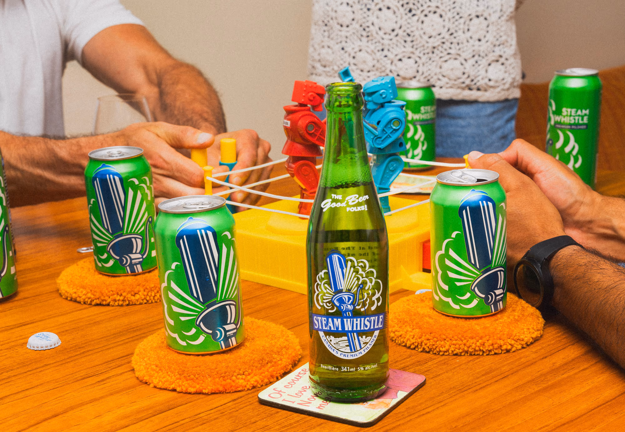 A steady-hands game built from cans and a bottle