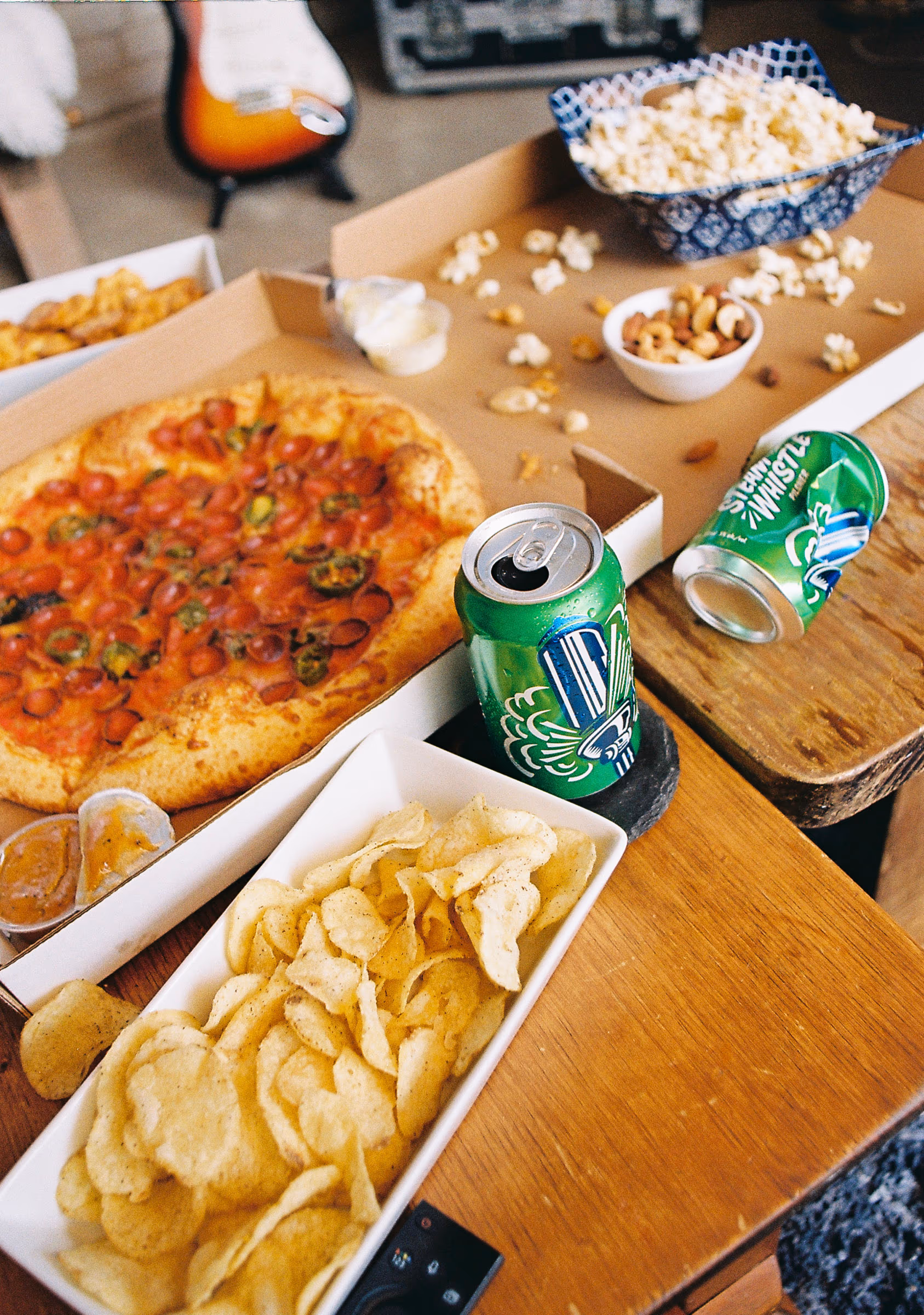 Two cans meeting over the pizza box