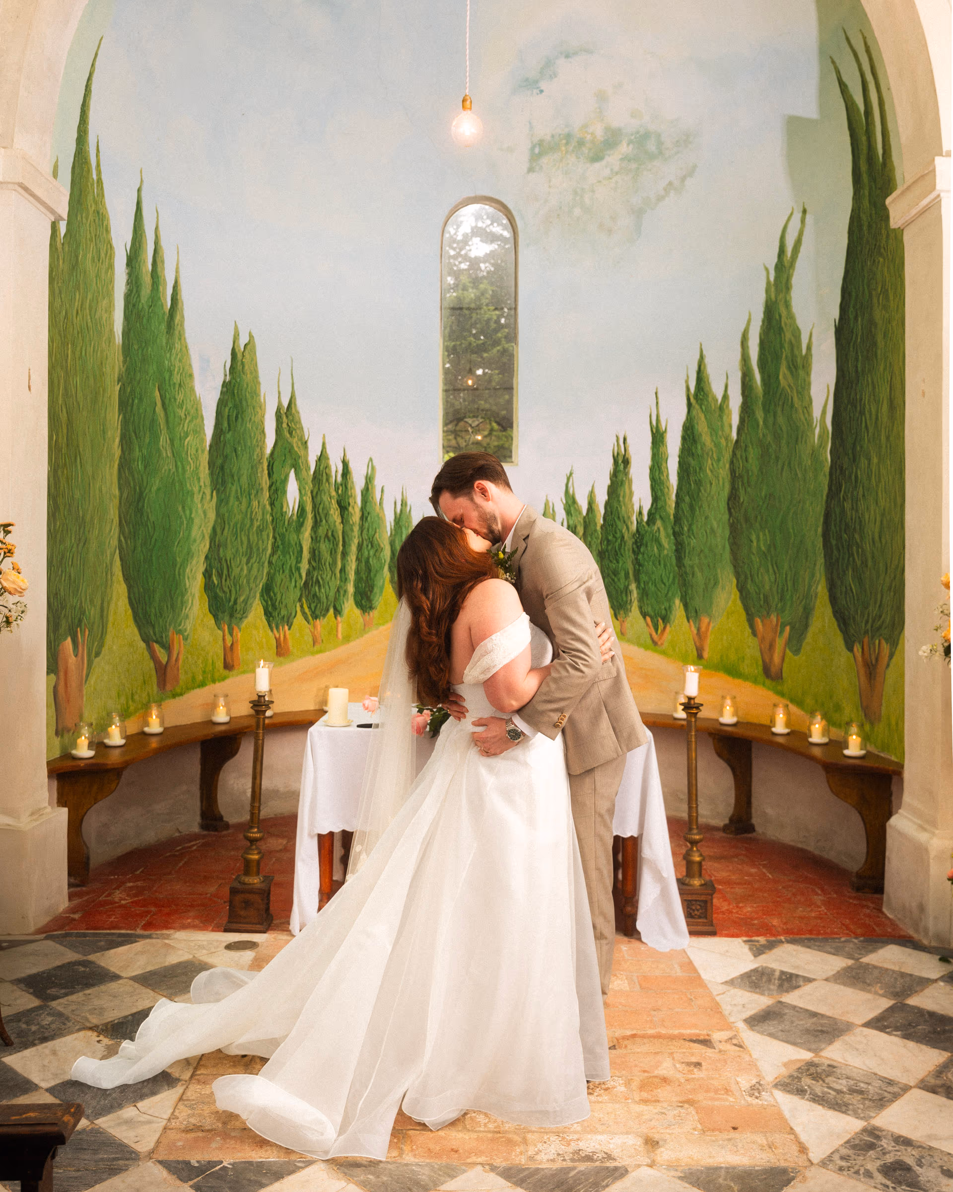 The first kiss in the chapel, checkered floor underfoot