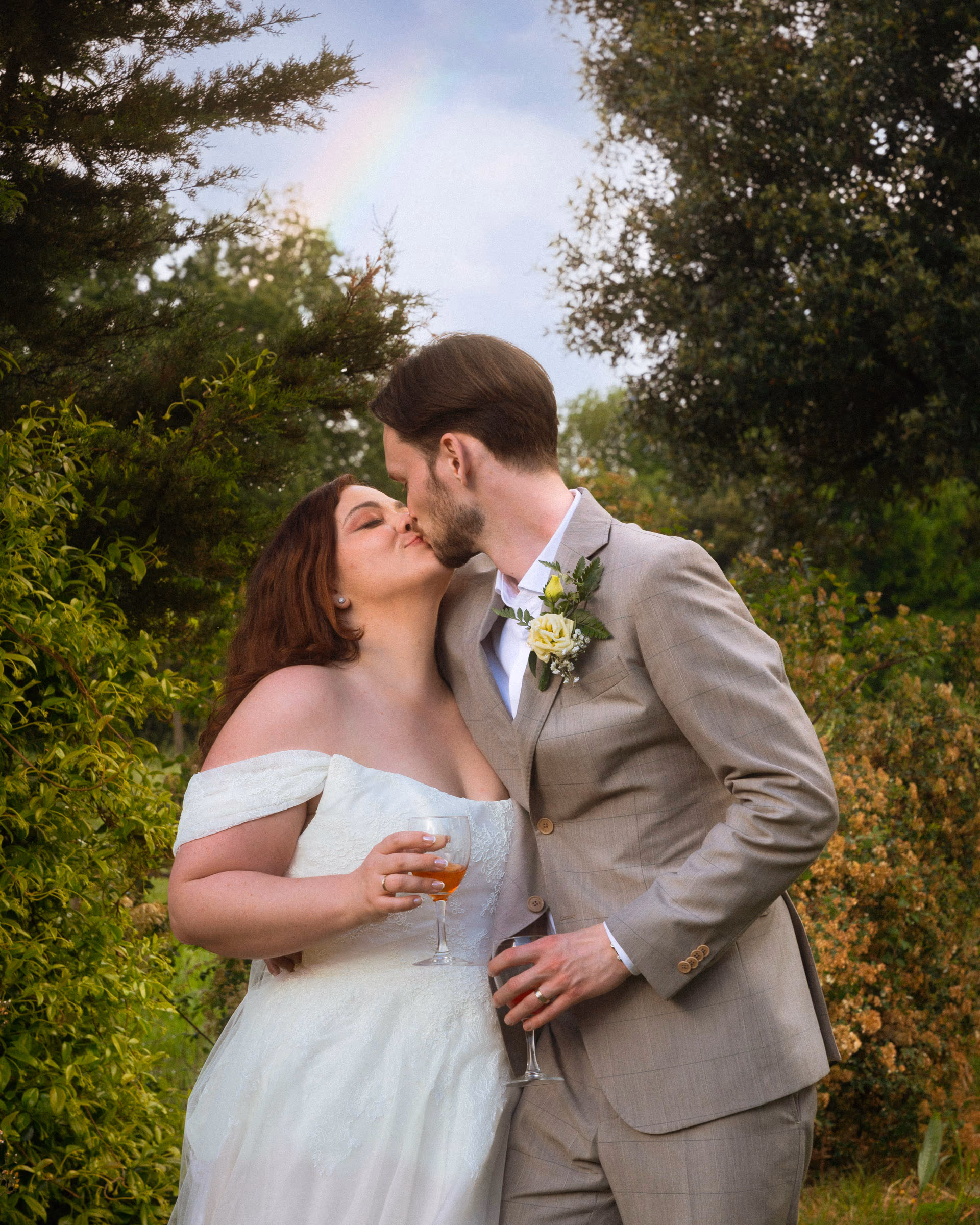 A kiss in the garden after the ceremony