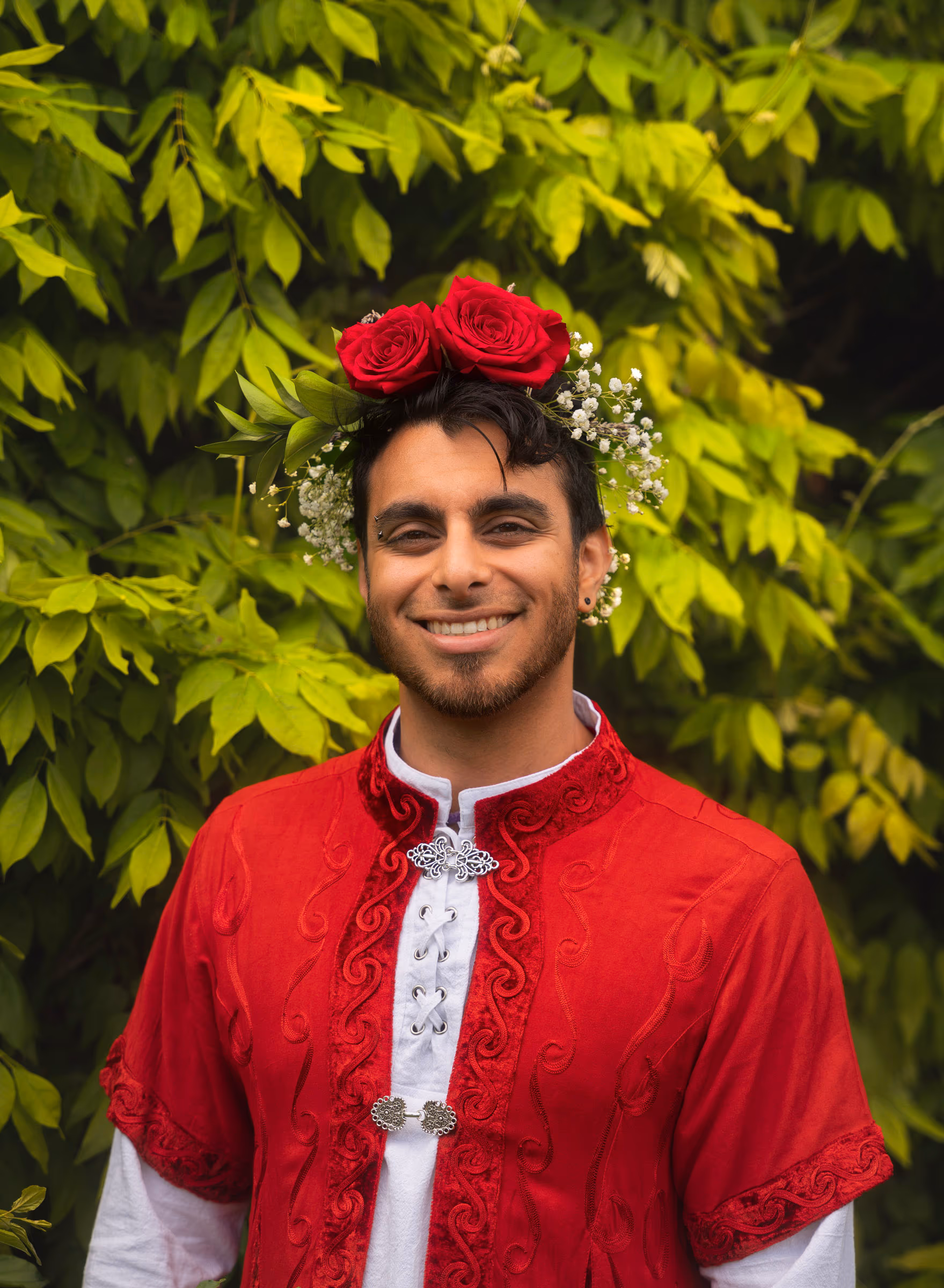 Matt in his embroidered red jacket and flower crown