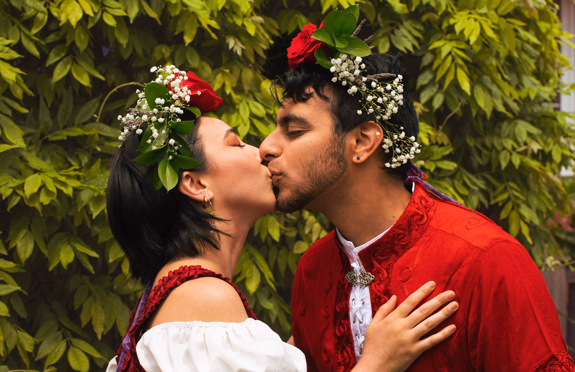 A kiss in their traditional reds