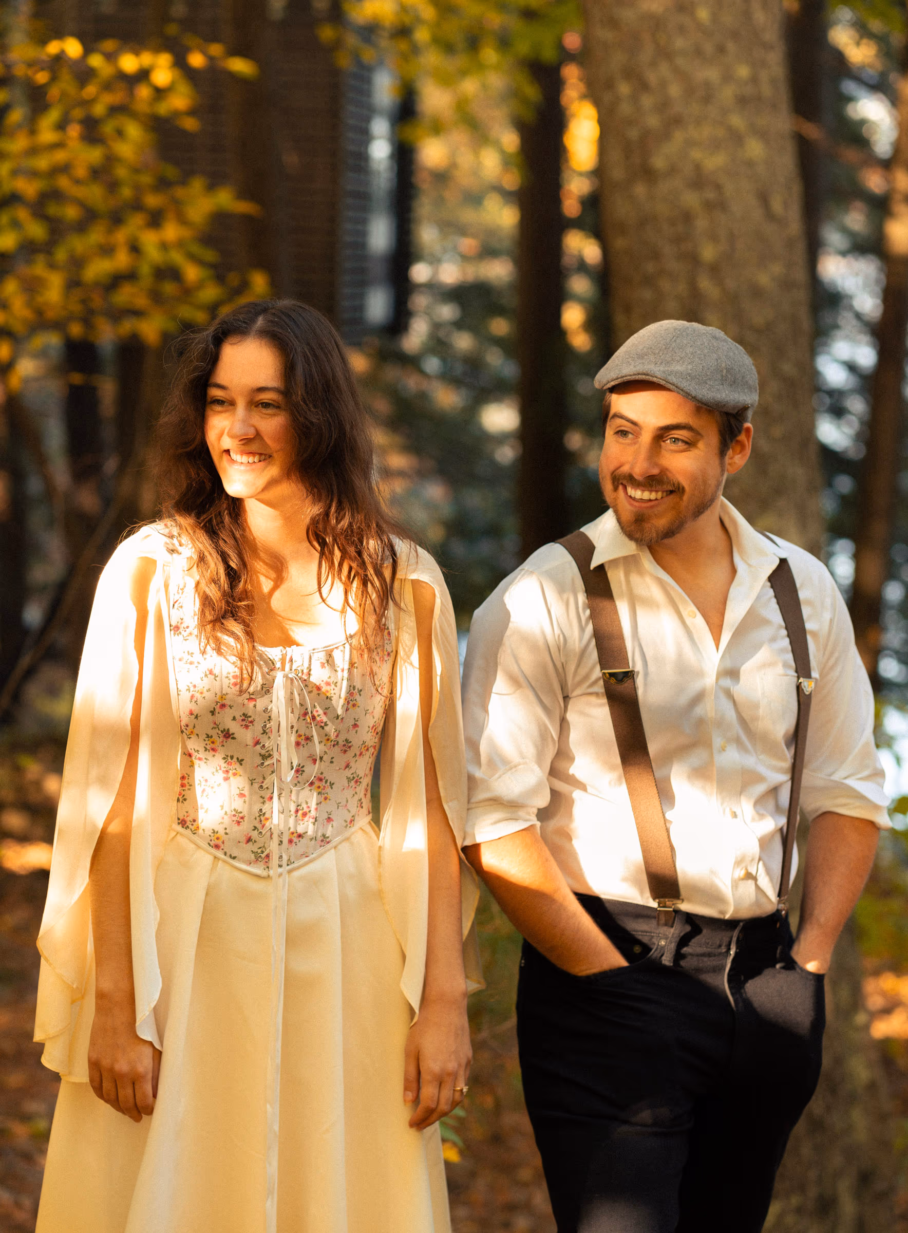 Walking through the woods wrapped in a shawl, mid-smile