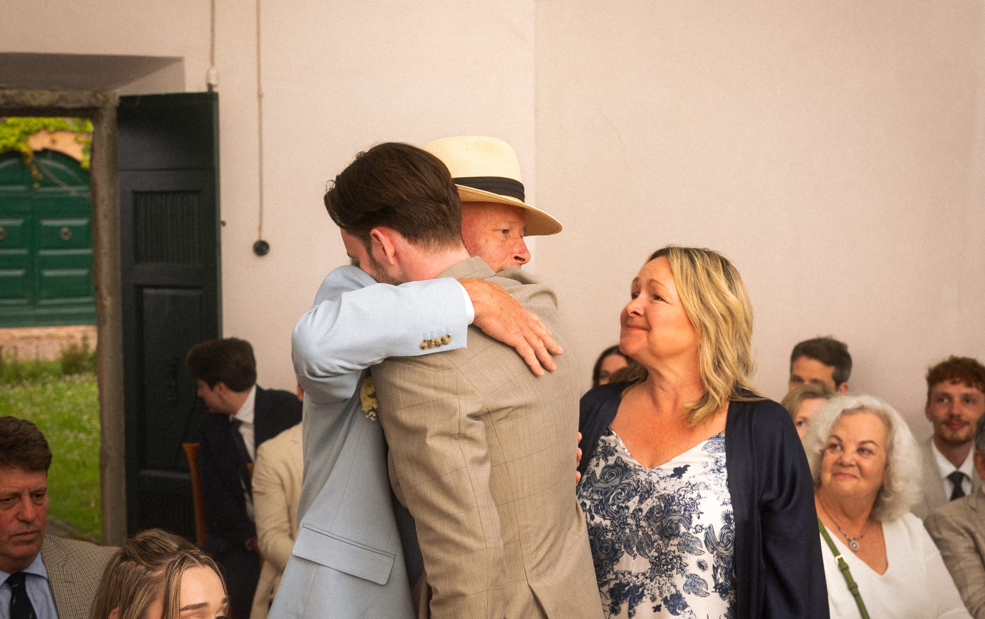 An embrace in the receiving line after the ceremony
